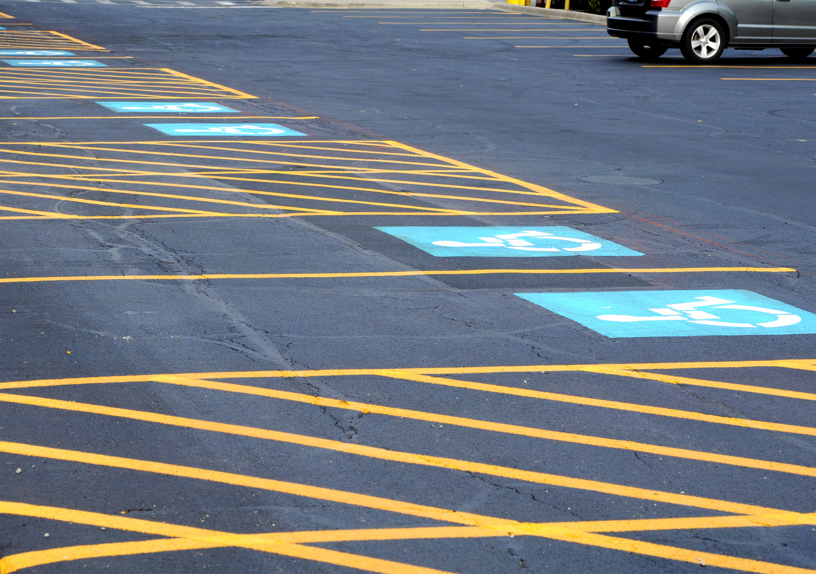 Striping is crucial for maintaining order, safety, and clarity on paved surfaces, contributing to the overall functionality and aesthetics of the area.
